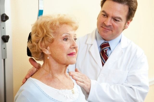 old woman consulting a doctor for her pinched nerve problems